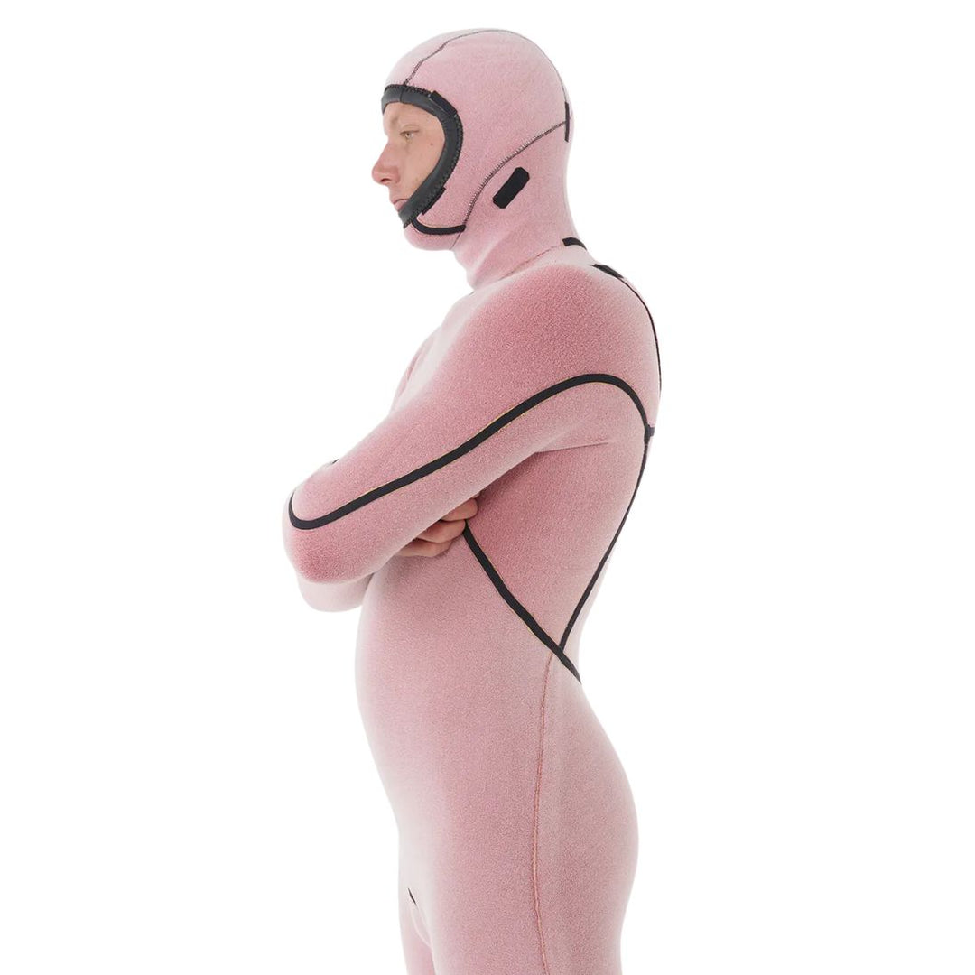 Person wearing a Rip Curl Flashbomb wetsuit inside out, showing the inner lining