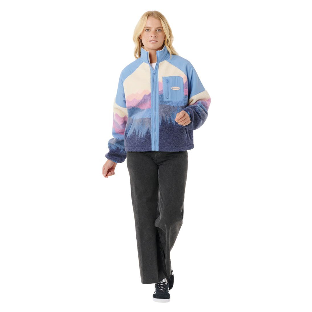Person wearing a colorful jacket with a white background
