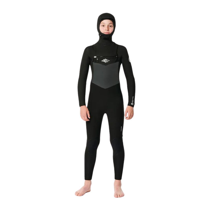 Child model wearing black Rip Curl Dawn Patrol 5/4mm Kids Hooded Wetsuit made from Yulex. Front View. 